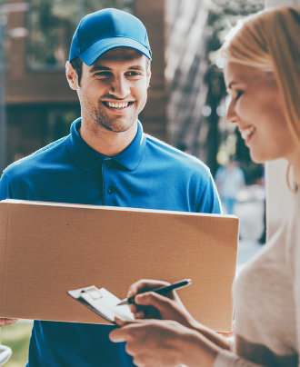 delivery man smiling to a woman